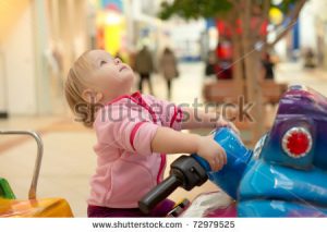 stock-photo-young-adorable-baby-ride-on-baby-motorcycle-look-up-out-01